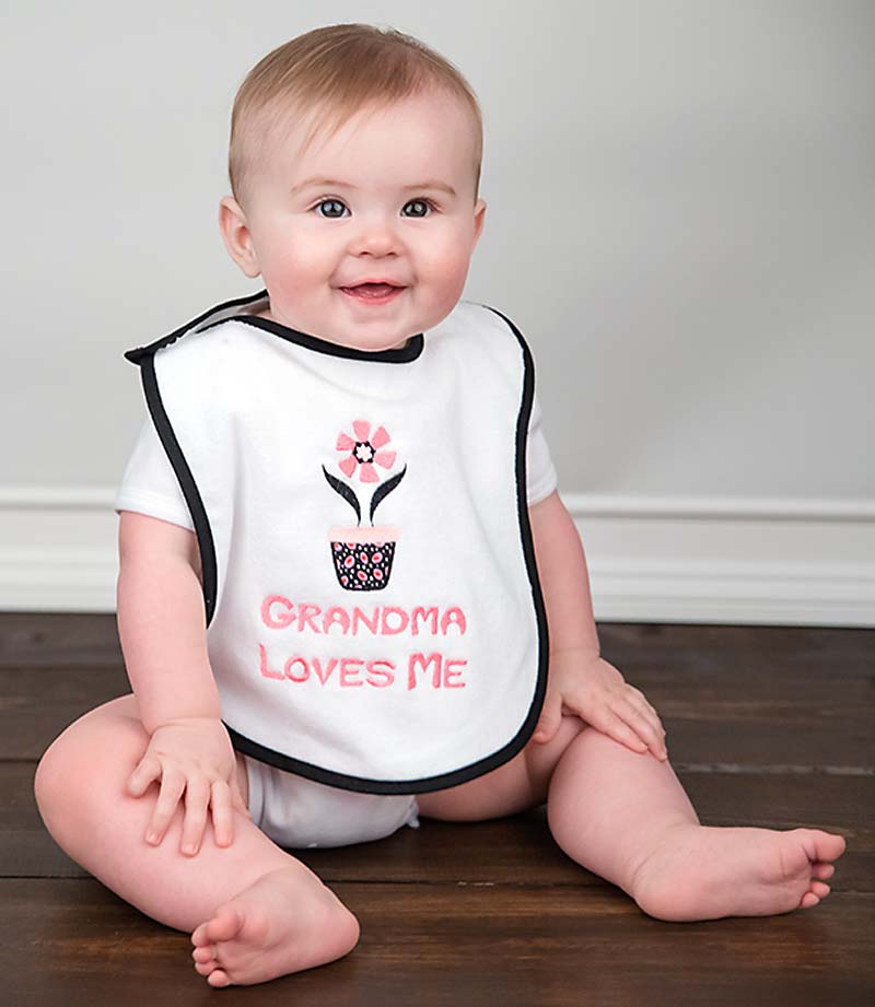 #A66931 "Grandma, Grandpa Loves Me" Appliqued and Embroidered Girl Bib